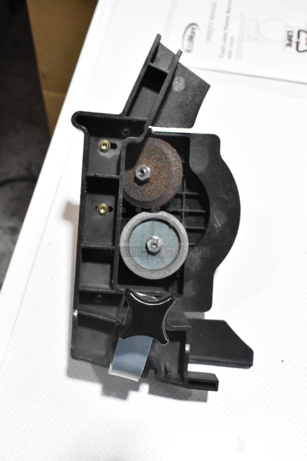 Bizerba SE 12 US countertop meat slicer with blade sharpener, 120V, 1 Phase, shown from above with visible control knobs.