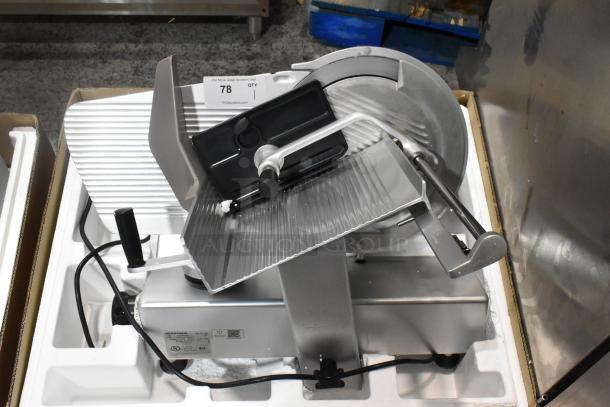 Bizerba SE 12 US commercial meat slicer with blade sharpener, 120 volts, 1 phase. Metal construction, countertop model.