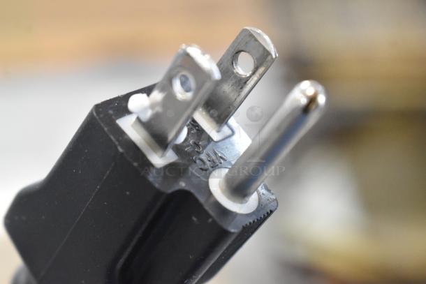 Close-up of a three-prong electrical plug for the Bizerba SE 12 US meat slicer, indicating 120 volts, 1 phase.