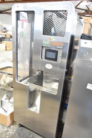 JBT Fresh N Squeeze stainless steel commercial citrus juicer, model 2ND-GEN-MFJ-HE, on casters, 120V, touchscreen display.