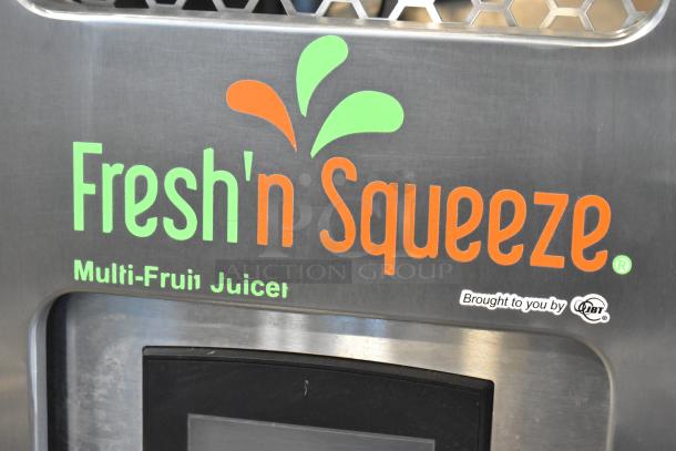 JBT Fresh N Squeeze stainless steel citrus juicer, model 2ND-GEN-MFJ-HE. Features "Fresh'n Squeeze" branding.