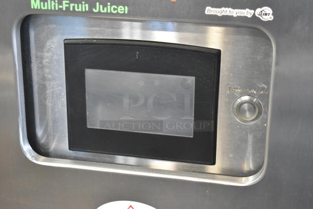 JBT 2ND-GEN-MFJ-HE citrus juicer, stainless steel, commercial floor style, touchscreen, 120V, on casters, power switch visible.