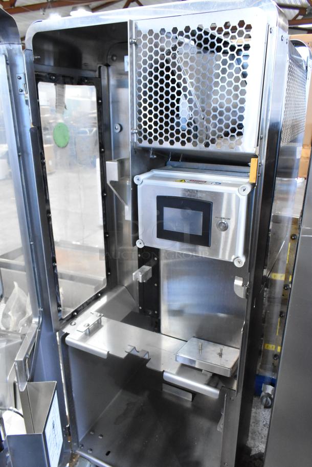 JBT 2ND-GEN-MFJ-HE citrus juicer in stainless steel, commercial floor style, on casters. Features touch screen panel. 120V, 1 phase.
