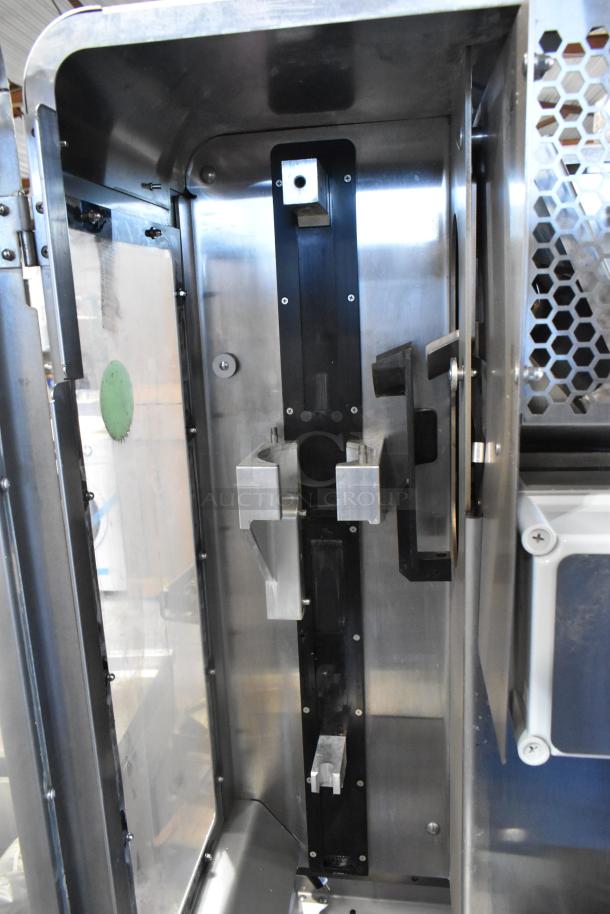 JBT 2ND-GEN-MFJ-HE stainless steel commercial citrus juicer interior showing metal components. 120V, 1 Phase.