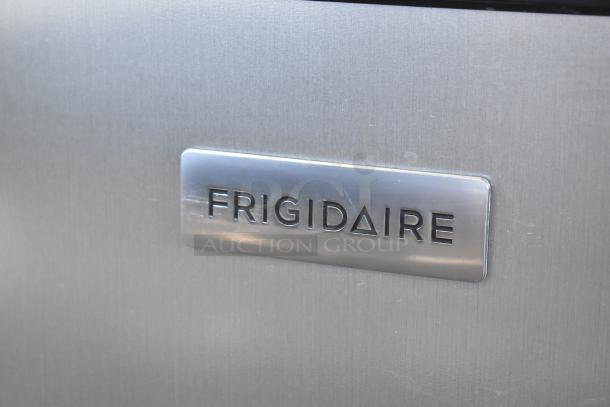 Frigidaire EFRF698-6COM stainless steel reach-in freezer with visible brand logo, operates at 115 volts, 1 phase.