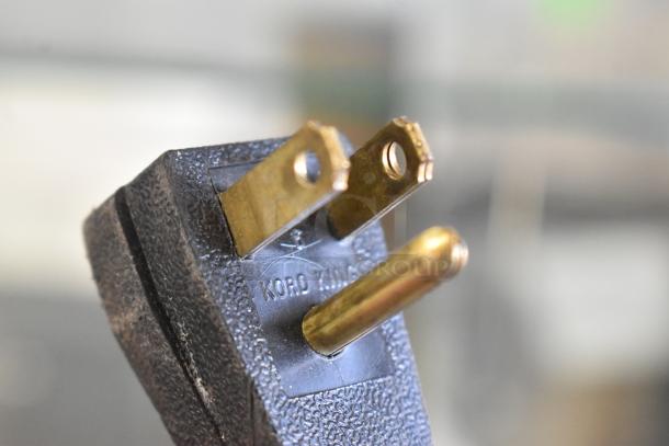 Close-up of an electrical plug marked "Kord King," likely for the True GDM-12 commercial cooler, 115 Volts, 1 Phase.