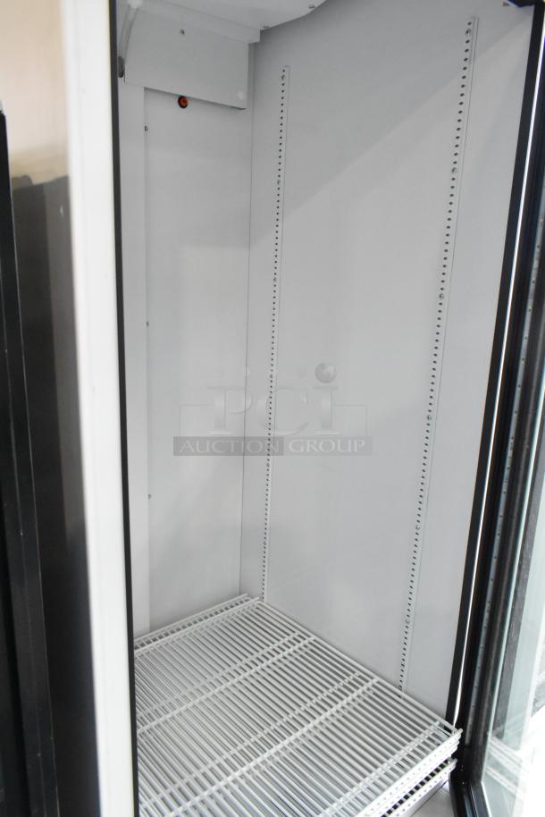 2021 True TSCI-600R-G-PH single door cooler with poly coated racks, 115V, 1 phase, in excellent condition.