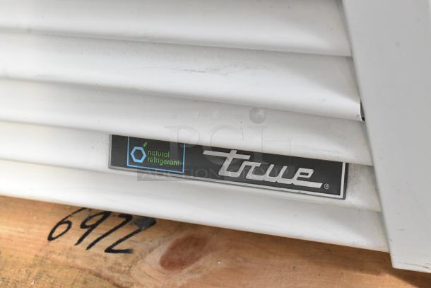 2021 True TSCI-600R-G-PH cooler fan vent with True logo and "natural refrigerant" label.