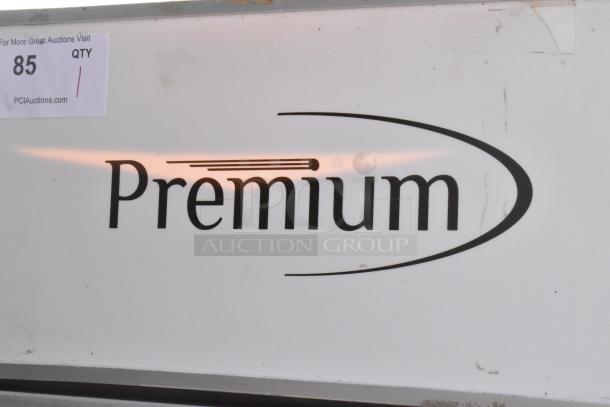 Premium PRF90DX metal single door reach-in cooler with poly coated racks, 115 volts, 1 phase. Visible branding and auction label.