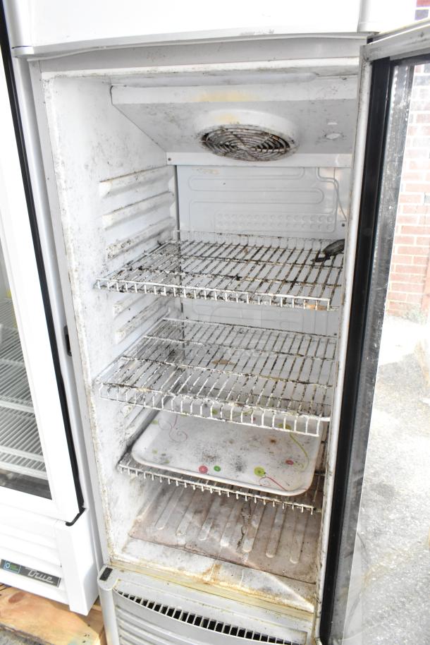 Premium PRF90DX single door cooler, metal with poly-coated racks, commercial use. Visible wear and interior residue.