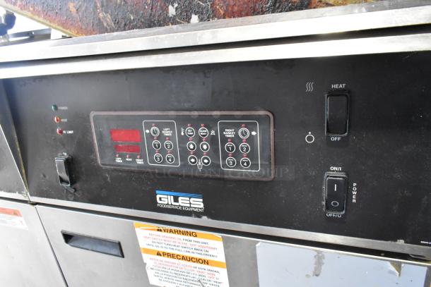 Giles EOF-24 stainless steel 3-bay fryer; electric, center dumping, on casters. Control panel and warning labels visible.