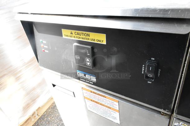 Giles EOF-24 stainless steel 3 bay fryer with center dumping station, commercial casters, 480V, 3-phase, in good condition.