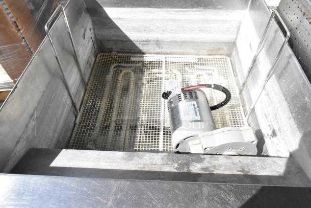 Giles EOF-24 stainless steel 3-bay deep fat fryer with center dumping station, on commercial casters. 480V, 3-phase.