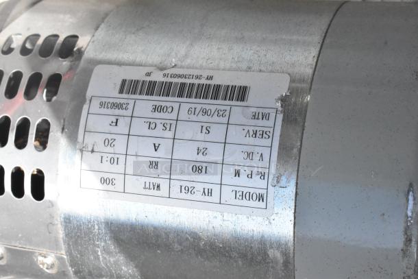 Stainless steel component with a white label displaying model HY-261, serial 23060316, wattage 300, RPM 180, and other specifications.