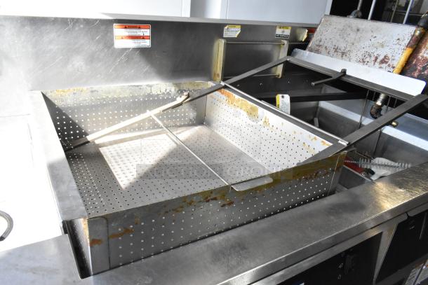 Giles EOF-24 stainless steel 3-bay deep fat fryer with center dumping station, on commercial casters, 480 volts, 3 phase.