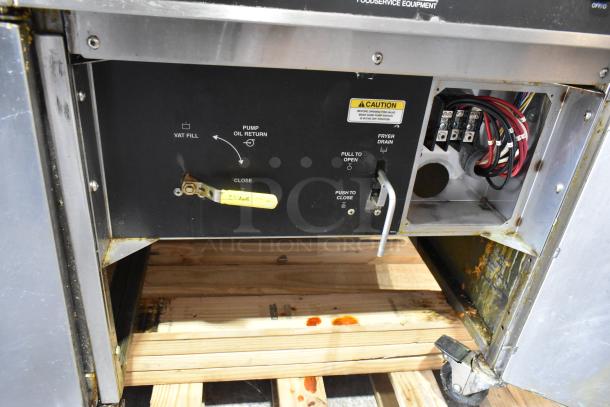 Giles EOF-24 stainless steel 3-bay fryer, 480V, 3-phase, with center dumping station on casters. Visible control panel.