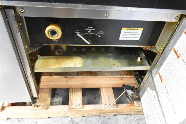Giles EOF-24 stainless steel 3-bay deep fat fryer with center dumping station, on commercial casters, 480V, 3-phase.