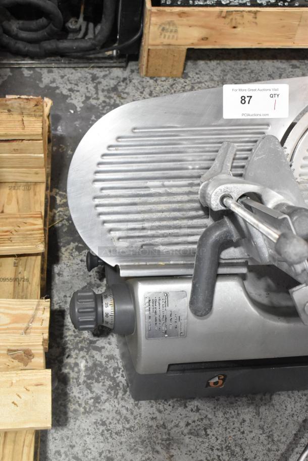 Hobart 2912 stainless steel commercial meat slicer, in good condition. Features 115 volts, 1 phase, visible control knob.