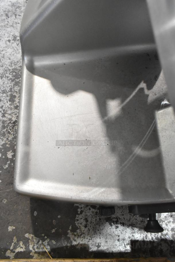 Hobart 2912 stainless steel commercial meat slicer, 115 volts, 1 phase, countertop model. Used condition, signs of wear.