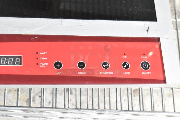 2023 Avantco 177IC18DB stainless steel 2 burner induction range, electric, minor surface damage, controls visible.