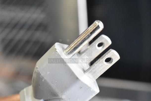 Close-up of a three-prong plug for the Solwave 180MW1000SS commercial countertop microwave oven.