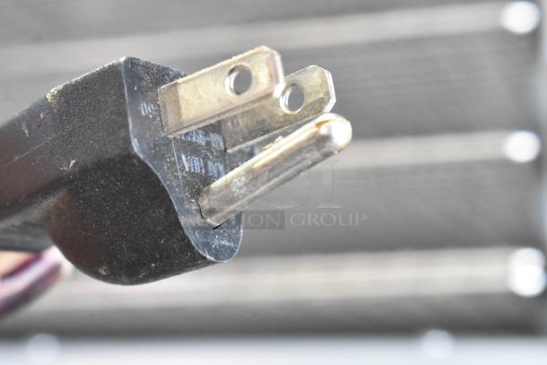 Close-up image of power plug for 2020 Cosori CP267-FD electric food dehydrator, showing standard three-prong connector.