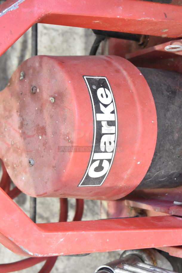 Clarke 1500DCR floor burnisher, 115V, 1 phase, red housing with visible logo, used condition.