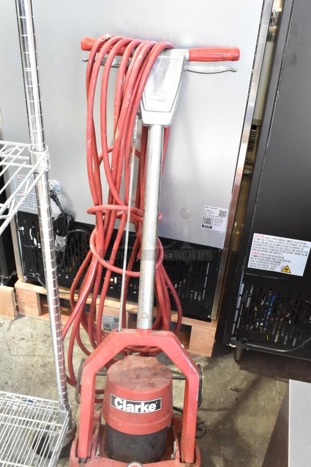Clarke Burnisher 1500DCR floor cleaning machine, red, with coiled power cord. 115 volts, 1 phase. Used condition.