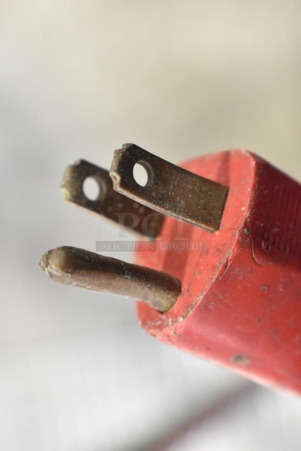 Close-up of a red electrical plug for the Clarke Burnisher 1500DCR Floor Cleaning Machine, model 1500DCR.