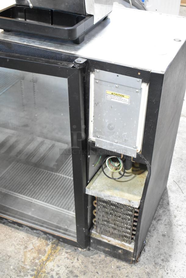 Beverage Air BB72G commercial 3-door back bar cooler, glass doors, metal finish, visible caution label, 115V, used condition.
