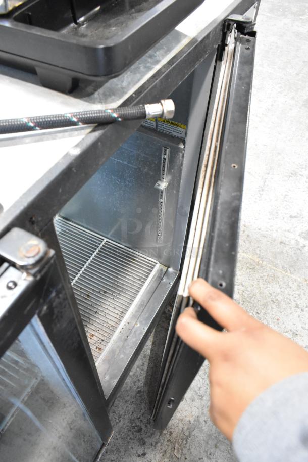 Beverage Air BB72G metal commercial 3-door back bar cooler, showing one door open. 115 volts, 1 phase. Visible interior and shelf.