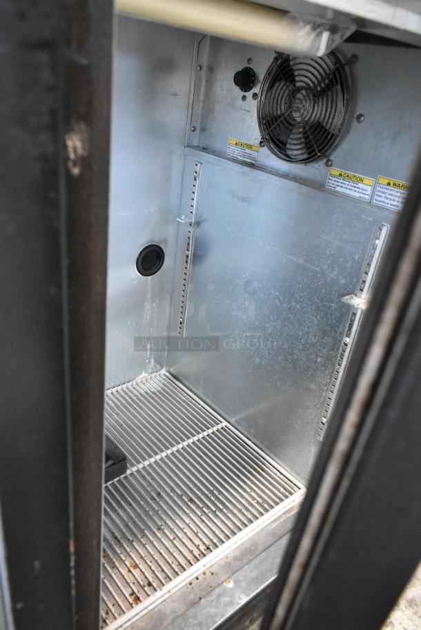Beverage Air BB72G metal commercial cooler interior with fan. Features three doors, 115 volts, and 1 phase. Used condition.