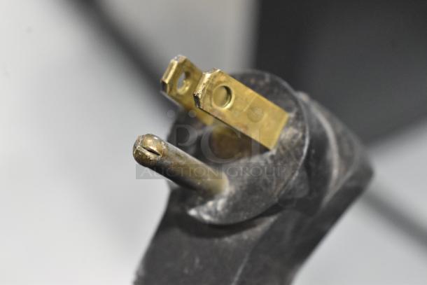 Close-up of a metal three-prong plug for the Beverage Air BB72G Back Bar Cooler, 115 volts, 1 phase.