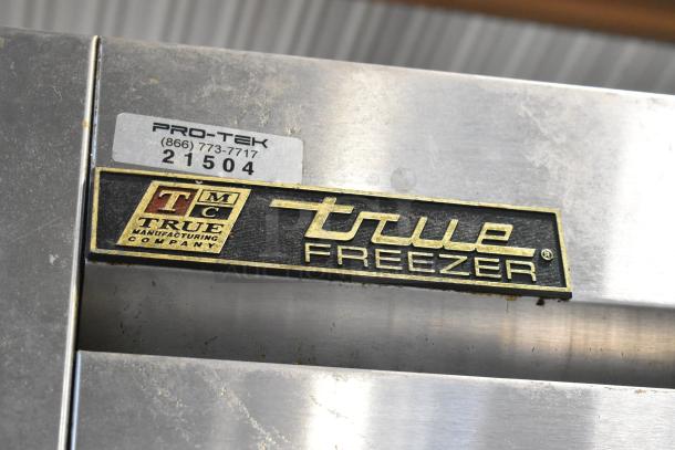True T-23F-2 stainless steel commercial freezer with two half-size doors, labels indicating model and manufacturing details.