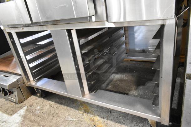 Baxter stainless steel mini rotating rack oven on double pan rack, commercial casters, natural gas powered.