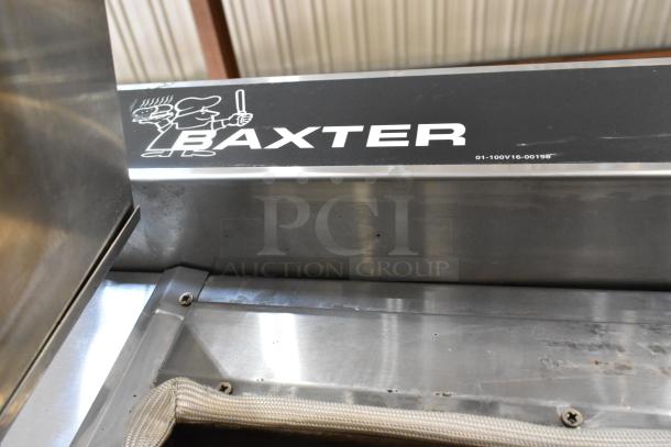 Baxter stainless steel commercial gas-powered mini rotating rack oven with double pan rack and casters, featuring brand logo.