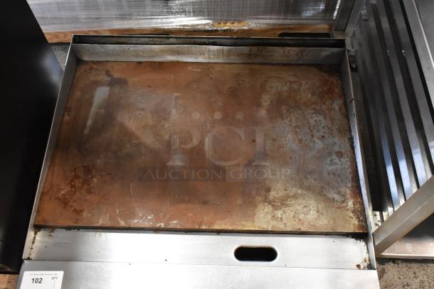 Garland Stainless Steel Commercial Gas Griddle in used condition, showing surface wear and signs of previous use.