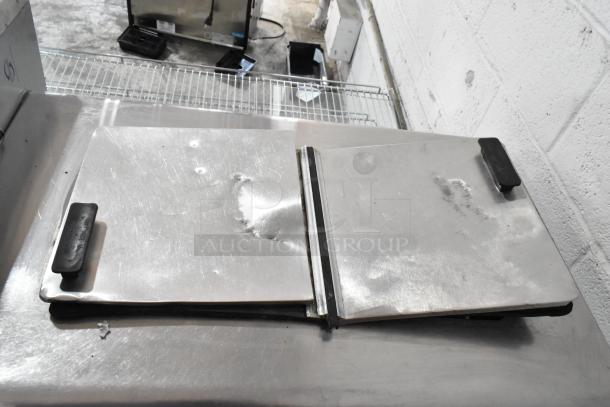 Globe Metal Chest Freezer, 115 Volts, 1 Phase, visible dents on top, metal handles, commercial use condition.