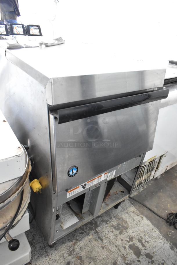 Hoshizaki F-330BAJ stainless steel undercounter ice machine. 115V, 1 phase. Shows surface wear, visible labels, and Hoshizaki logo.