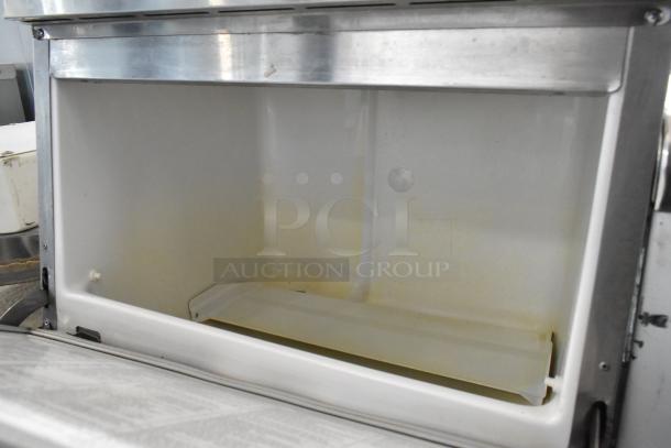 Hoshizaki F-330BAJ stainless steel ice machine, self-contained undercounter model, 115V, 1 phase, interior view.