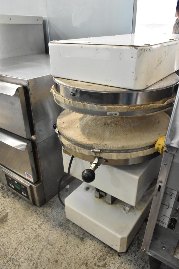 Spizza Metal Commercial Countertop Dough Press in used condition, 220V, 1 Phase, with visible wear and operational knobs.