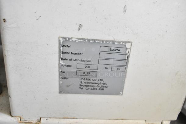 Spizza Metal Commercial Countertop Dough Press, 220V, 1 Phase. Model: Spizza. Label displays technical specifications.