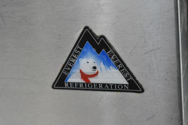 Everest stainless steel commercial cooler logo, featuring a polar bear with a red scarf, set against a mountain backdrop.