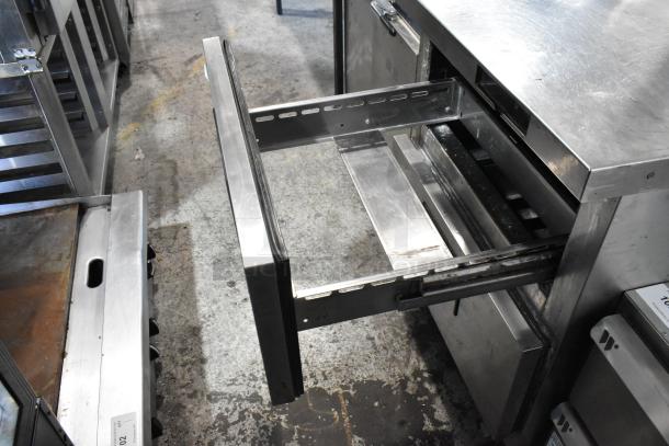 Everest stainless steel 2-drawer undercounter cooler on casters, commercial use, 115 volts, 1 phase, in used condition.