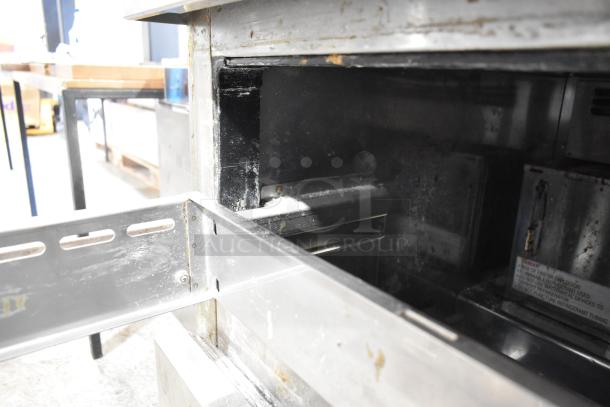 Everest stainless steel 2-drawer undercounter cooler on commercial casters, 115 volts, 1 phase, visible interior condition.