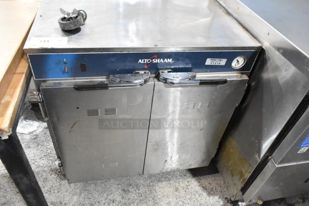 2017 Alto Shaam 750-CTUS stainless steel heated holding cabinet, 2 doors, on casters, 120V, showing some wear.