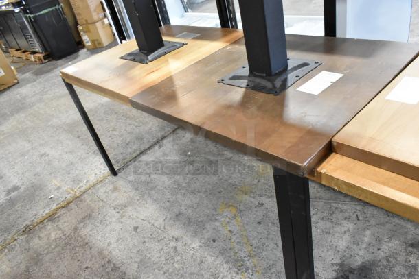 6 wooden tables with metal legs, various wood tones, durable metal bases. Includes visible tags with details. Great condition.