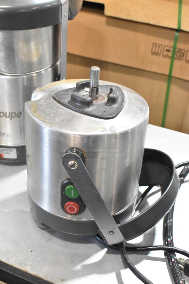 Two Robot Coupe J 80 Ultra citrus juicers; one missing top. 120 volts, 1 phase. Stainless steel bodies, power buttons visible.
