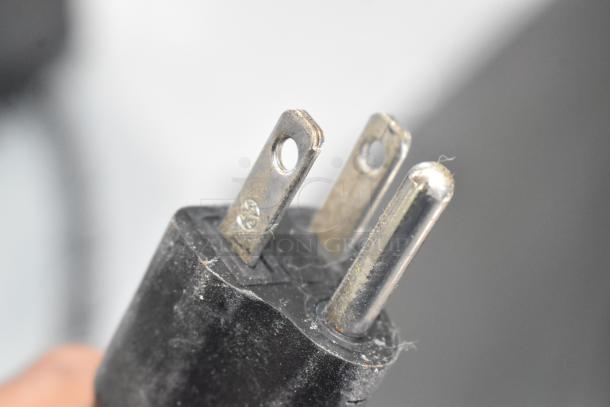 Close-up of a three-prong power plug with slight wear, belonging to Nuova Simonelli Oscar II AD espresso machine. 120 Volts, 1 Phase.