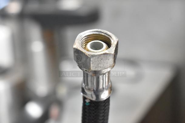 A close-up of a metal connector for the Nuova Simonelli Oscar II AD espresso machine, showing detailed threading.